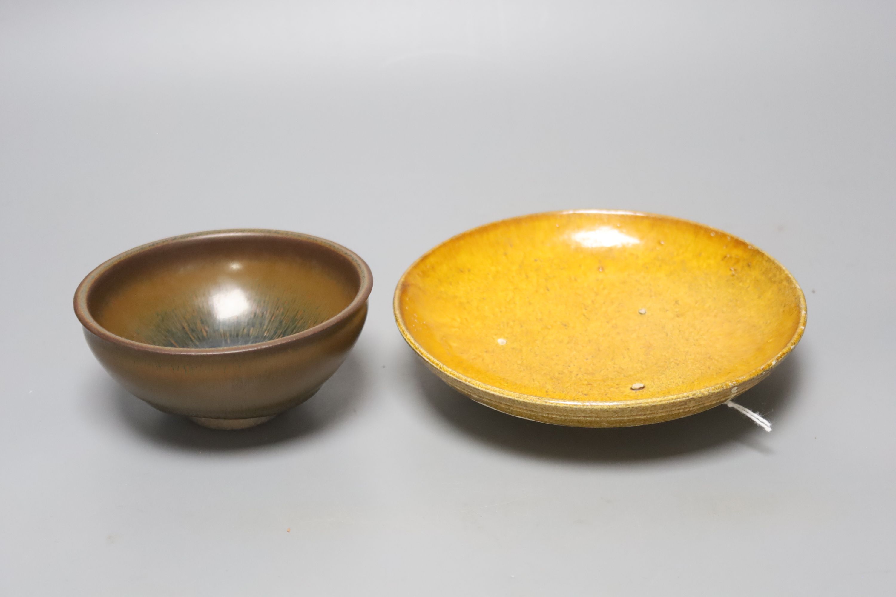 A Chinese amber-glazed pottery dish, Liao dynasty: and a jianyao hares fur teabowl, possibly Southern Song